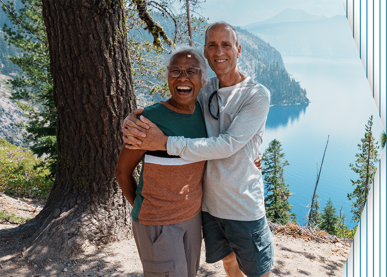 Smiling couple hiking in the mountains